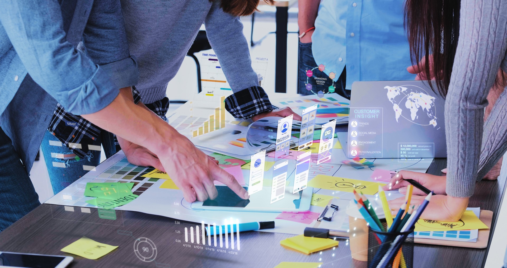 Close up ux developer and ui designer use augmented reality app brainstorming about mobile interface wireframe design on desk at modern office.Creative digital development agency